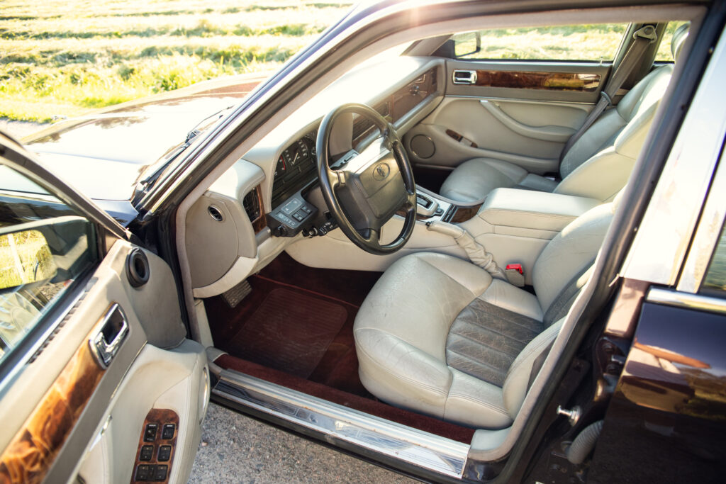 Luxury car interior with beige leather seats