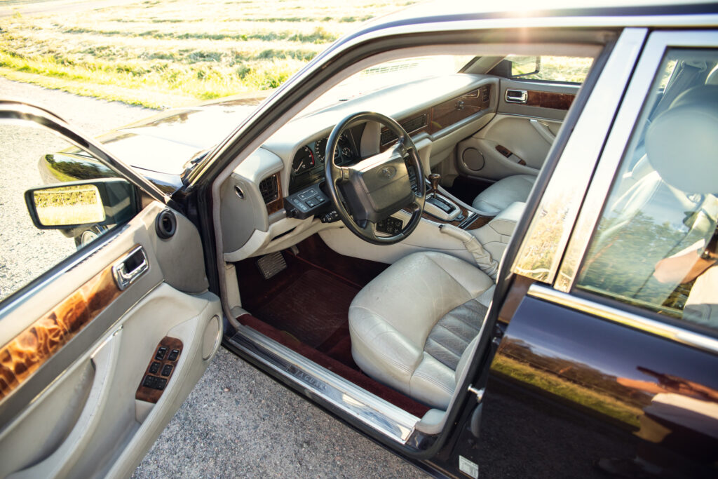 Luxury car interior with leather seats and wood trim