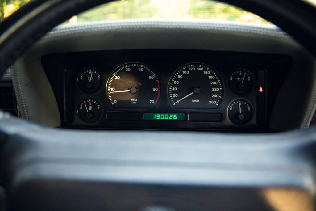 Car dashboard with speedometer and odometer reading