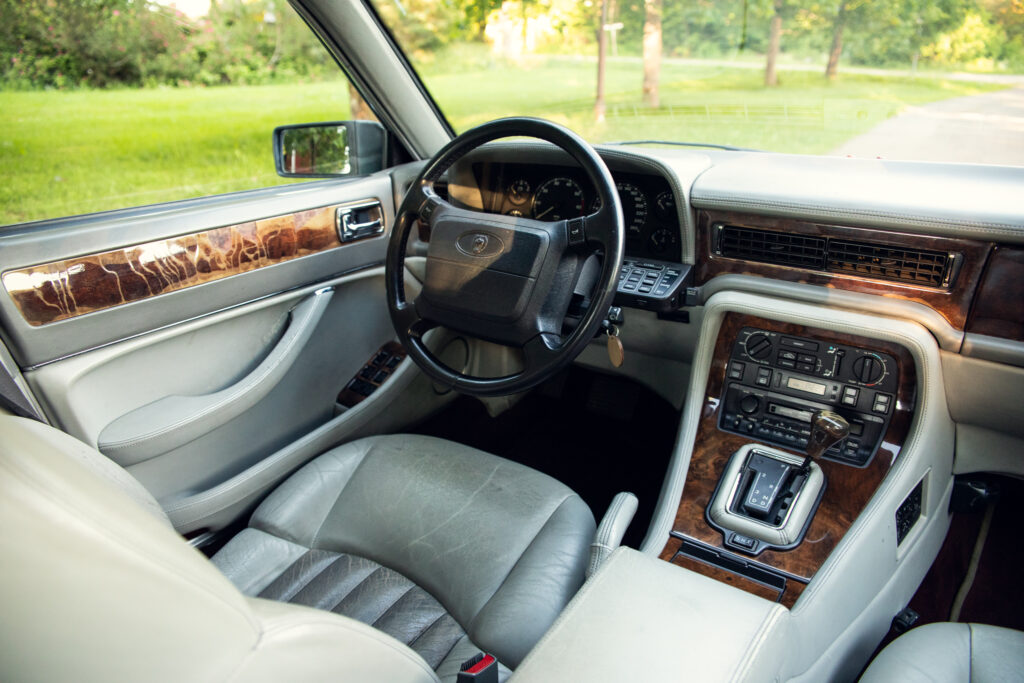 Luxury car interior with leather seats and wood trim