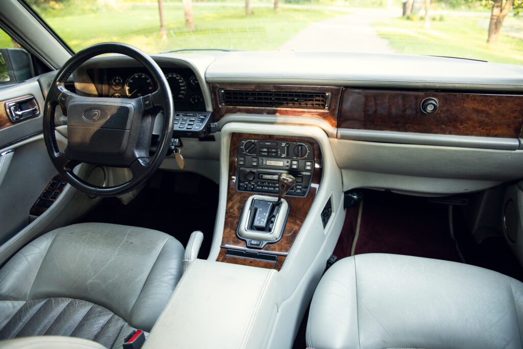 Luxury car interior with wood trim dashboard