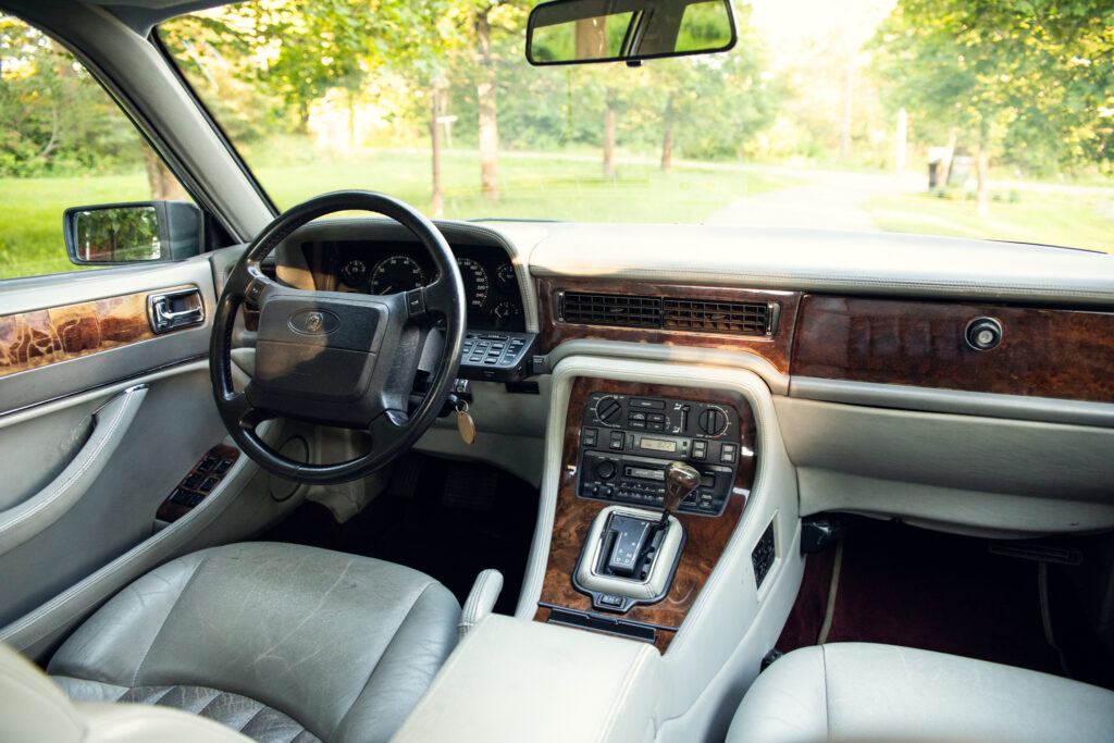 Luxury car interior with wood trim dashboard
