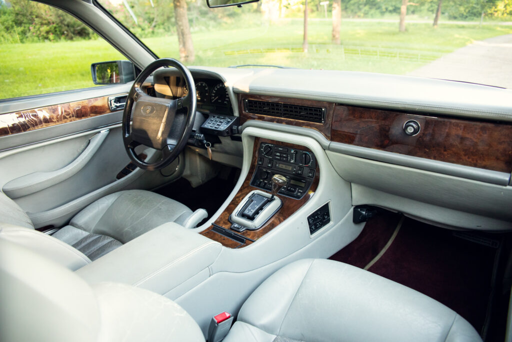 Luxury car interior with wood trim dashboard