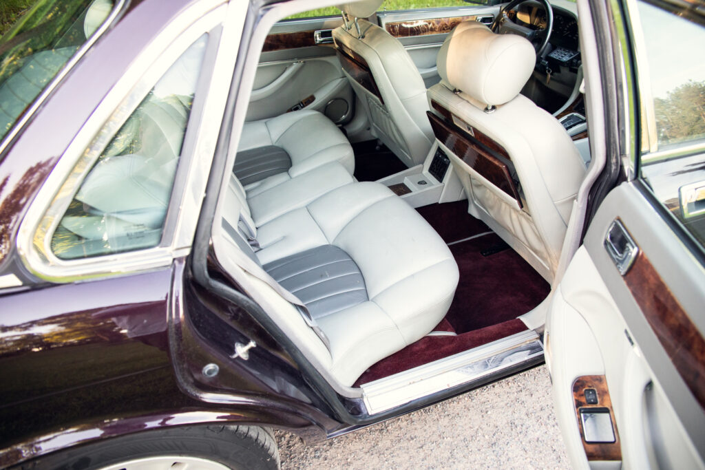 Luxury car rear seat with beige leather interior
