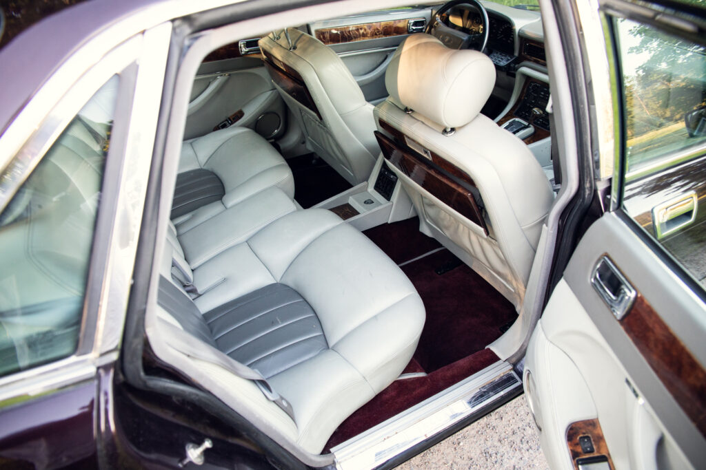 Luxury car interior with beige leather rear seats