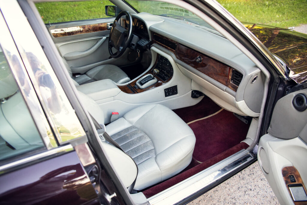 Luxury car interior with leather and wood trim