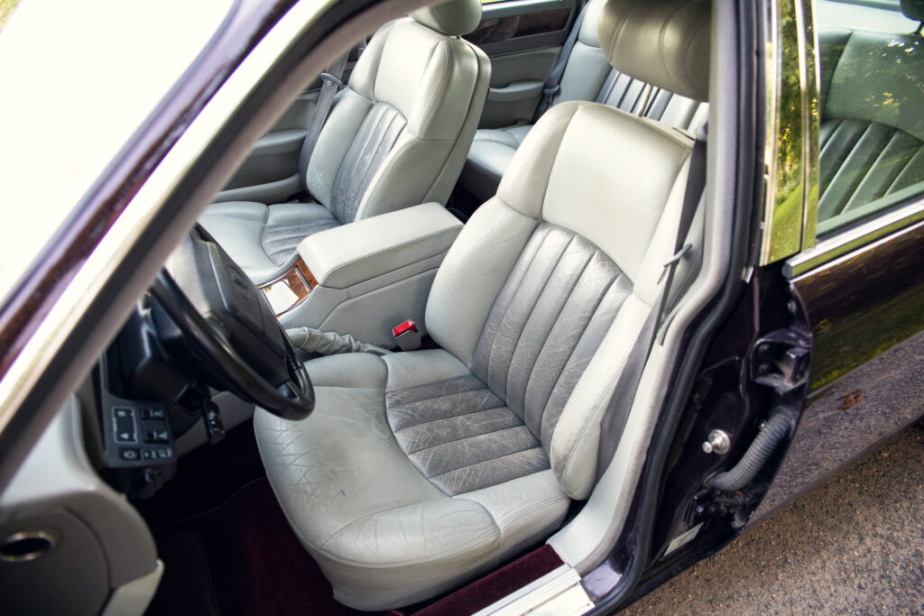Light gray leather car interior front seats
