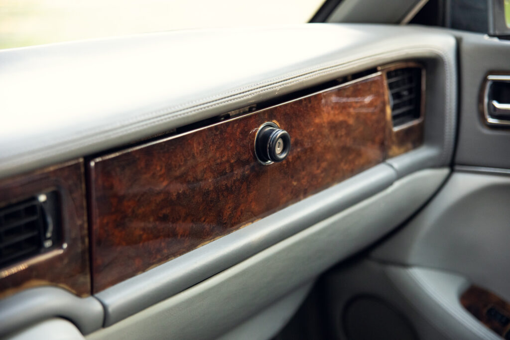 Car dashboard with wood trim and lighter socket