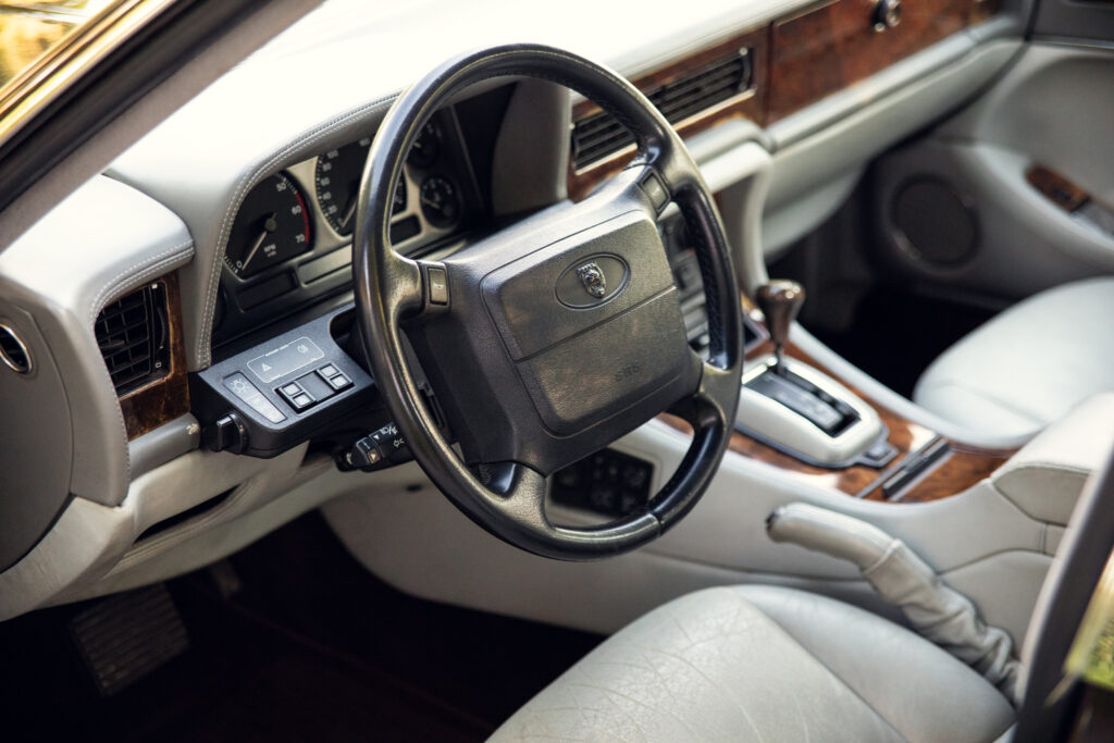 Luxury car interior with leather and wood trim