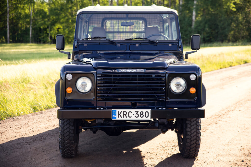 Front view of Land Rover Defender on dirt road