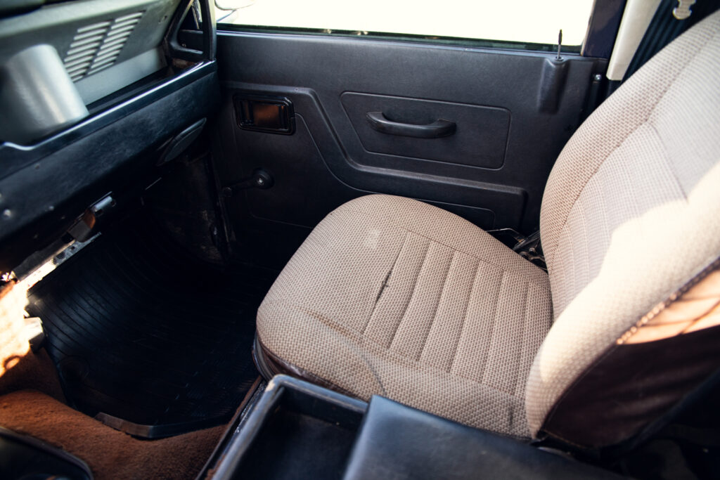 Vintage car interior with fabric passenger seat