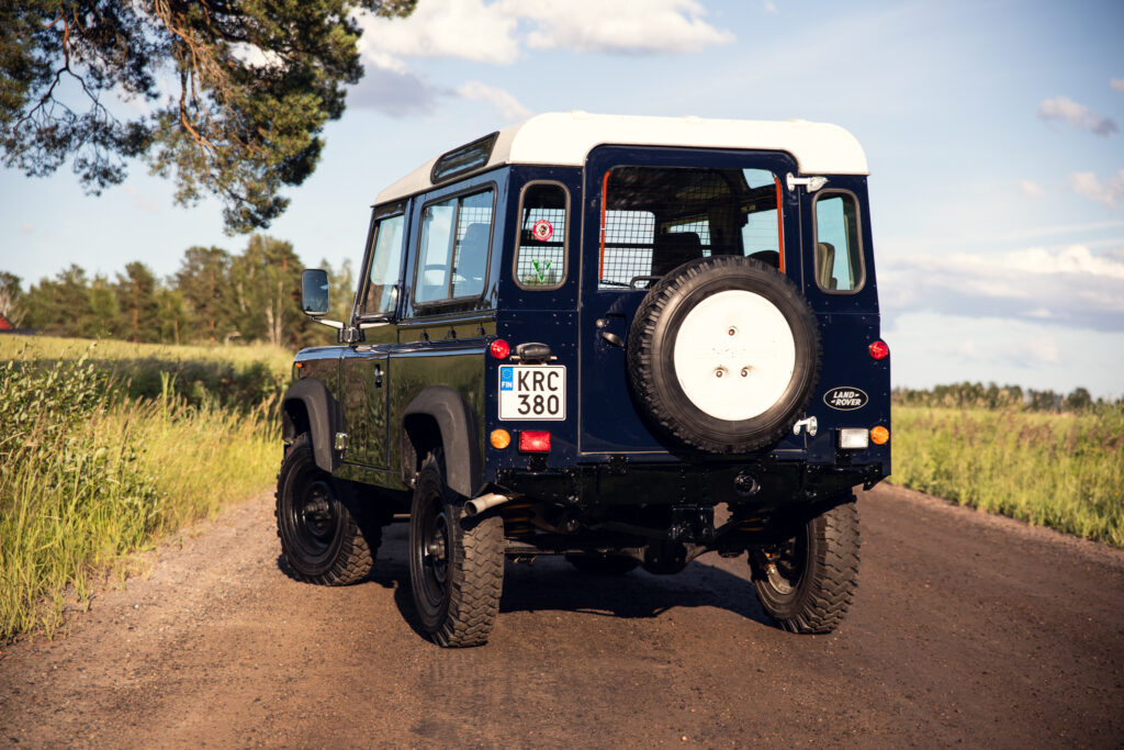 Classic Land Rover Defender on rural dirt road