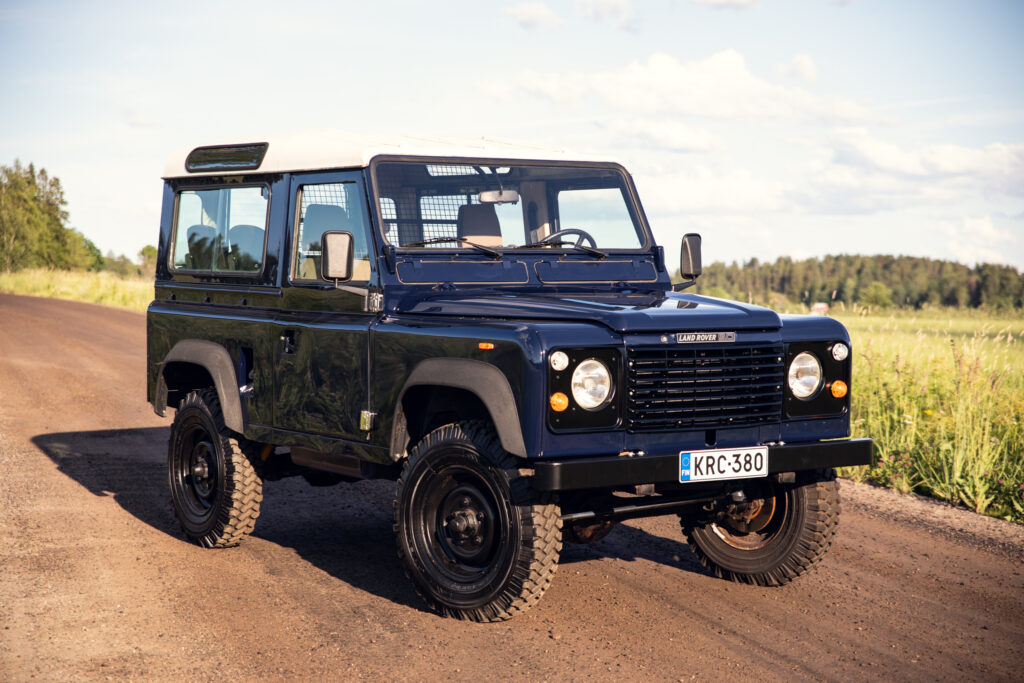 Classic Land Rover Defender on rural dirt road