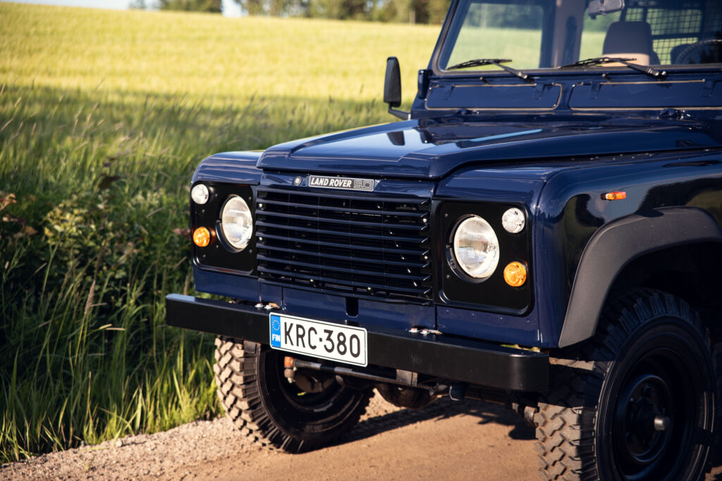 Front view of blue Land Rover Defender