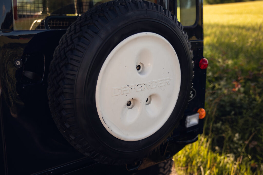 Rear-mounted spare tire on Land Rover Defender