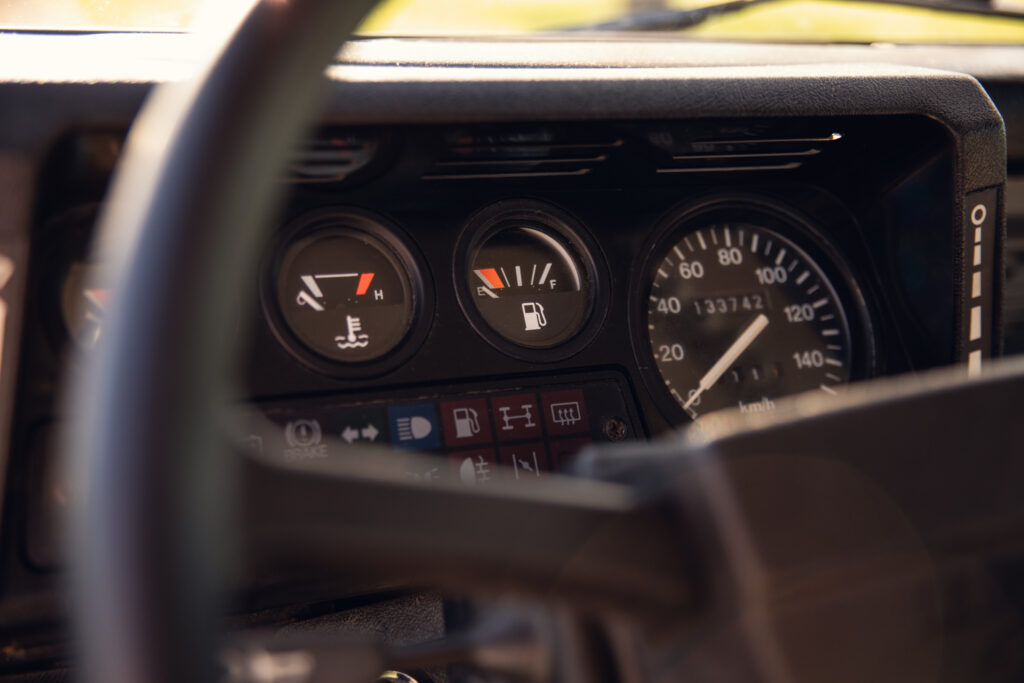 Close-up of car dashboard gauges and speedometer
