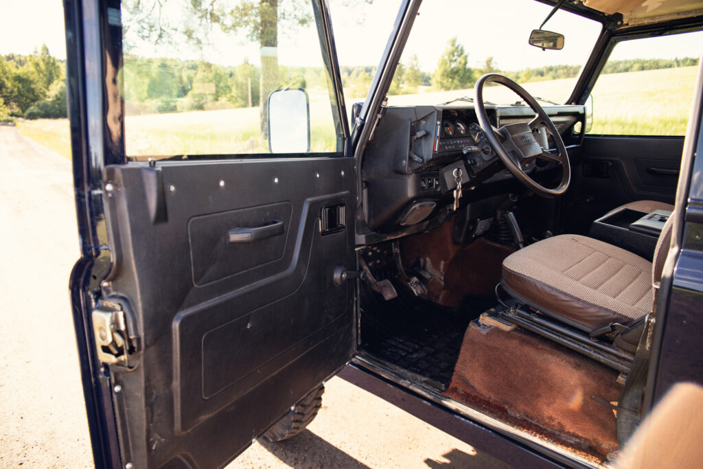 Interior of rugged off-road vehicle with open door