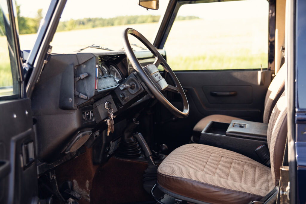 Interior of vintage off-road vehicle with steering wheel