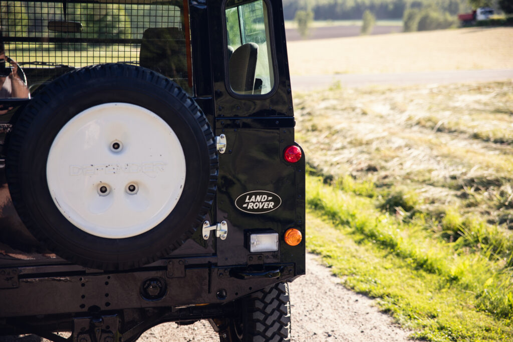 Rear of Land Rover Defender with spare tire
