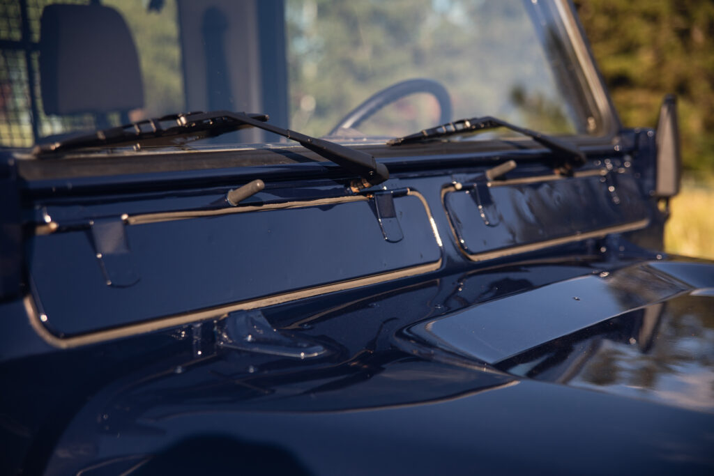 Close-up of windshield wipers on blue SUV