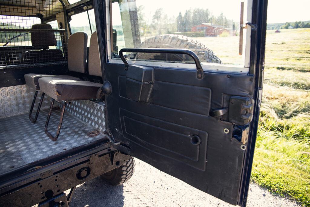 Open door of rugged off-road vehicle interior