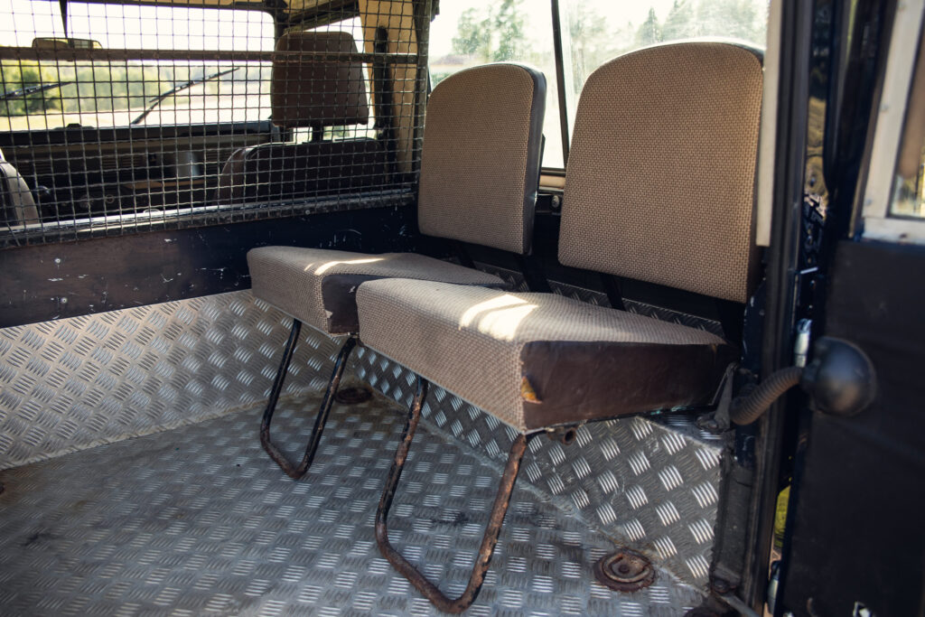 Two rear seats inside rugged off-road vehicle