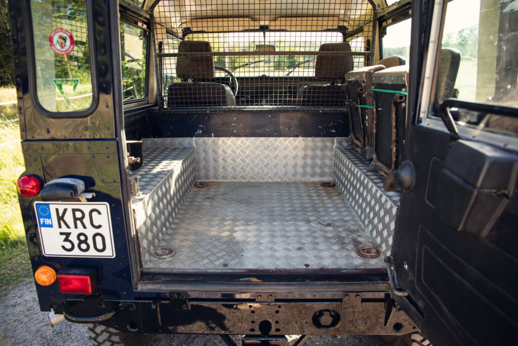 Open SUV cargo area with metal floor