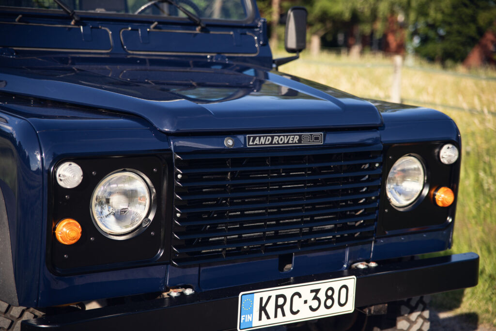 Front view of blue Land Rover Defender 90