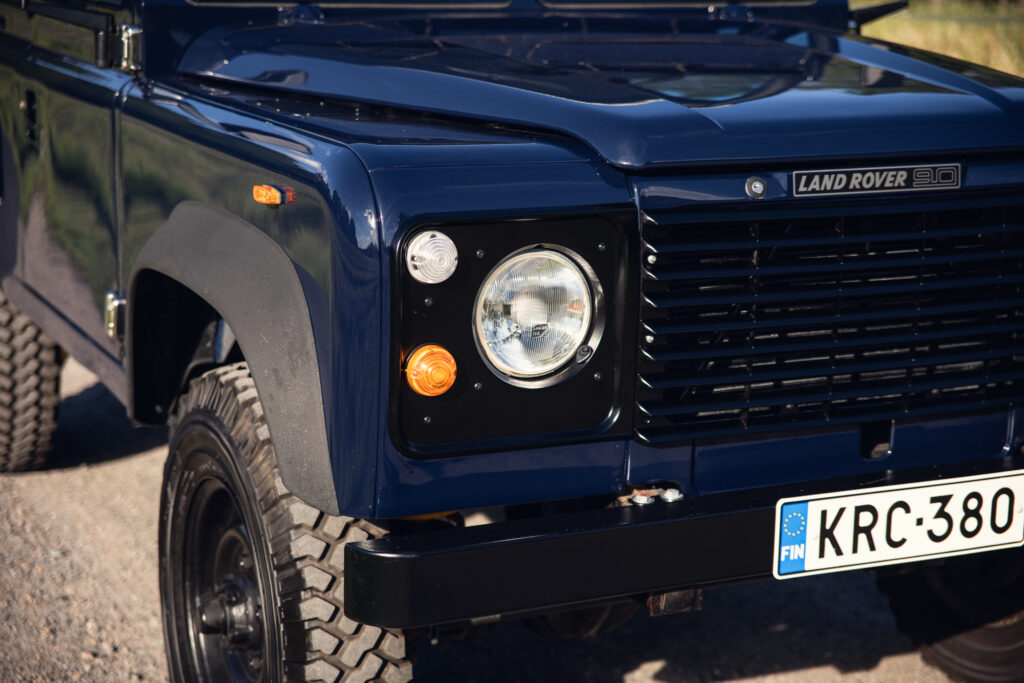 Front view of blue Land Rover 90
