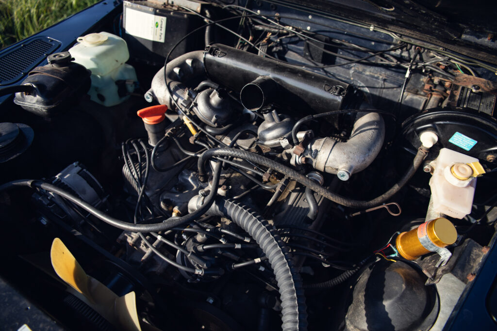 Close-up of car engine in open hood