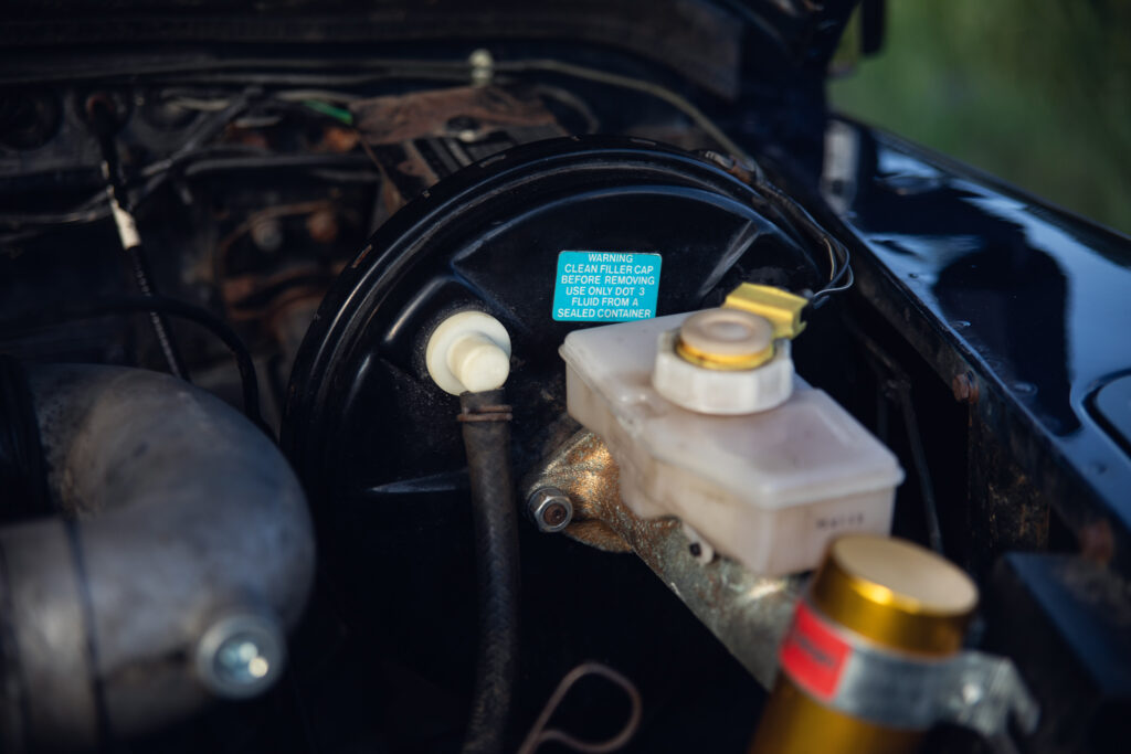 Car brake master cylinder and booster close-up