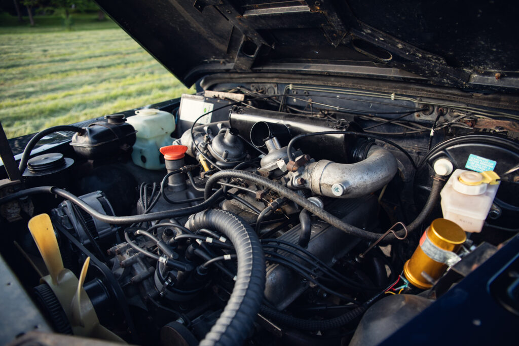 Close-up of car engine under open hood