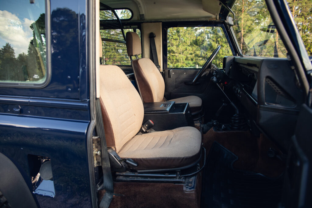 Interior of rugged off-road vehicle with beige seats