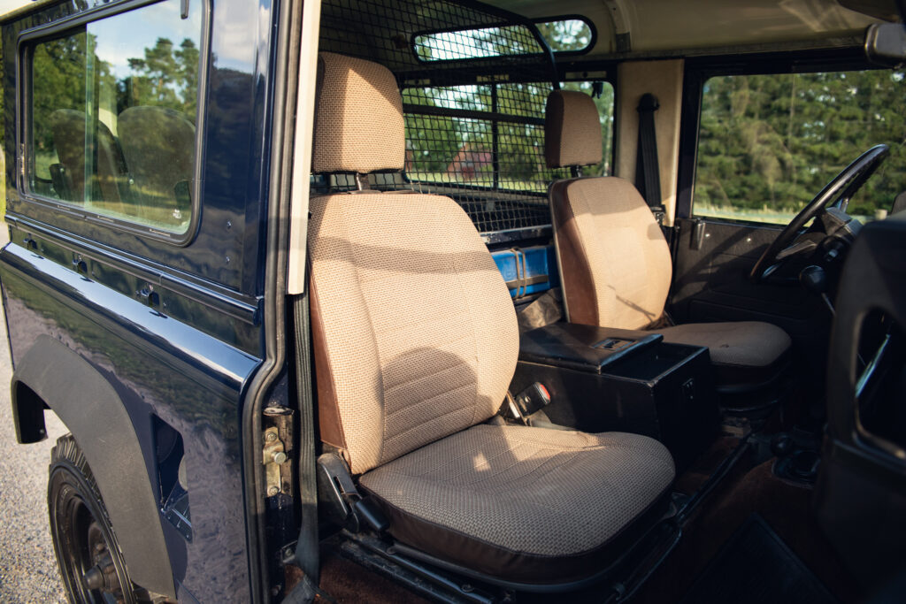 Interior of rugged SUV with open driver door