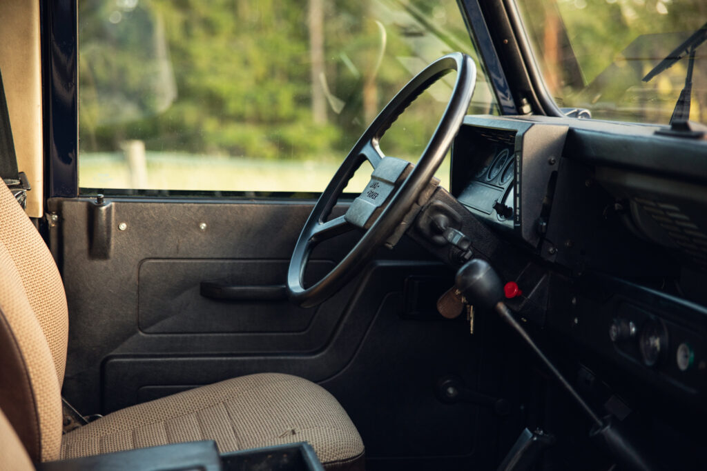 Interior of vintage off-road vehicle with steering wheel