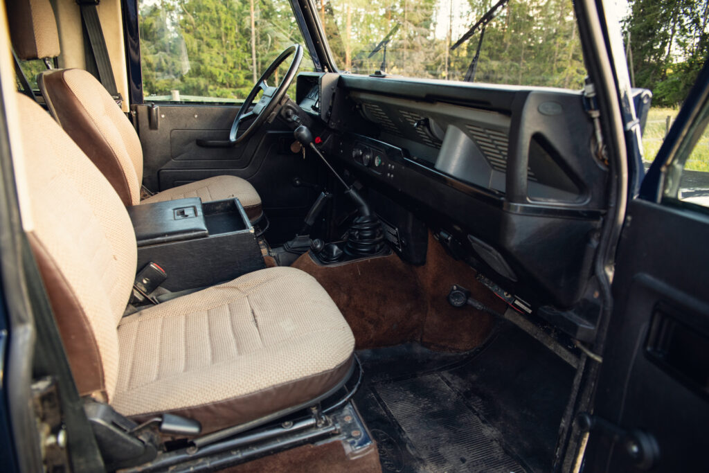 Vintage off-road vehicle interior with manual transmission