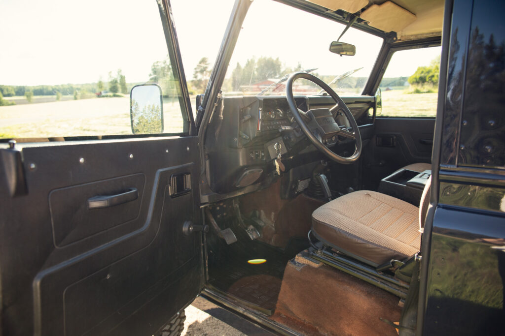 Interior of rugged off-road vehicle with open door