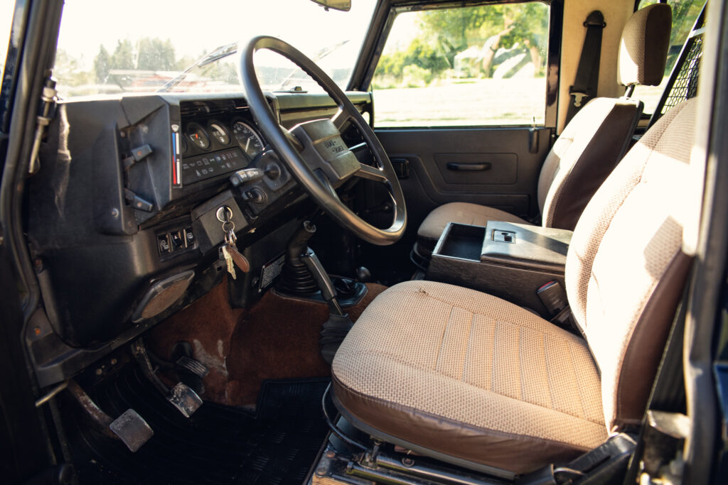 Interior of rugged off-road vehicle with manual transmission