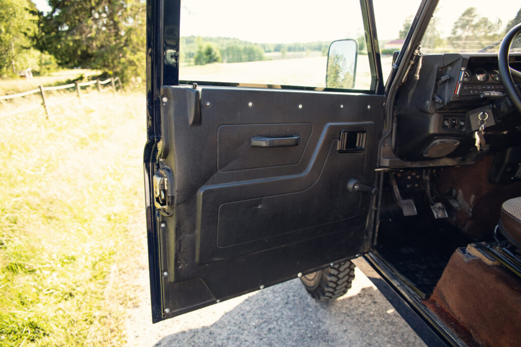 Open SUV driver door in rural setting