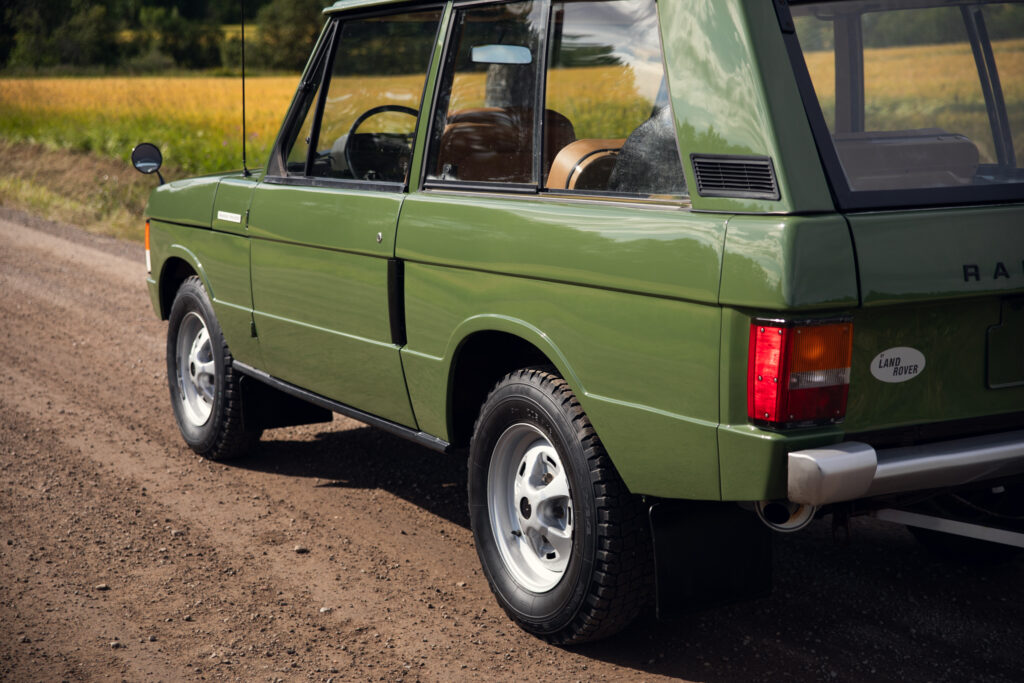 Vintage green Range Rover on dirt road