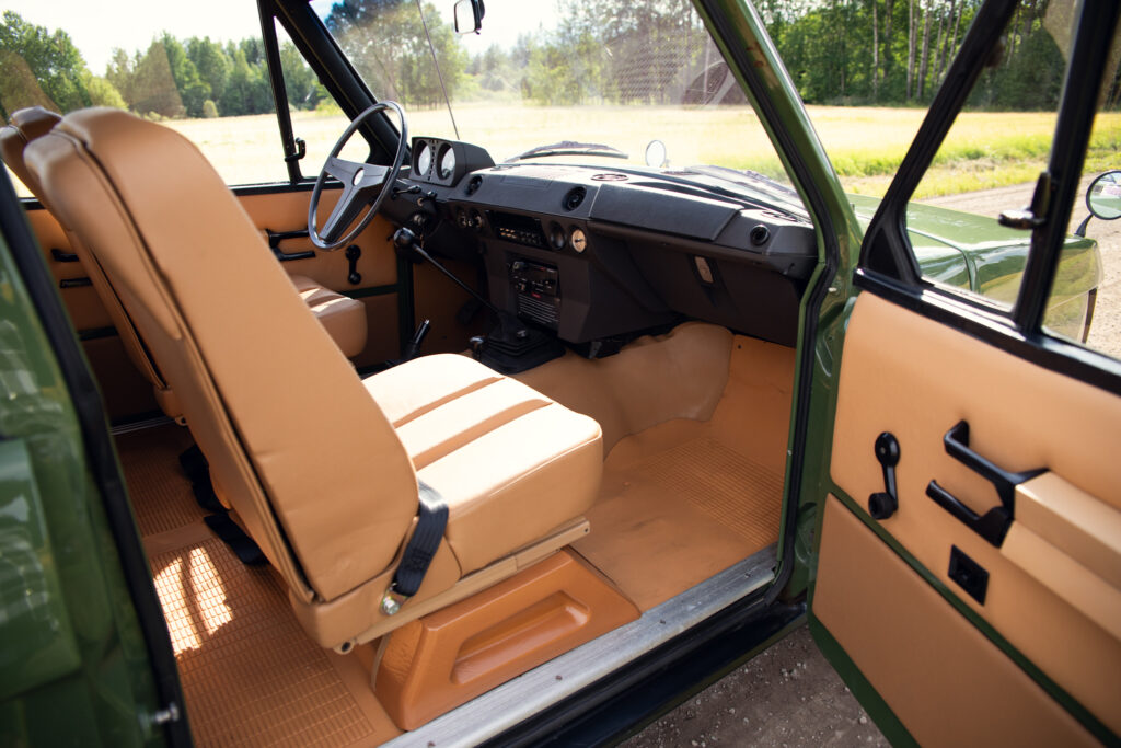 Vintage off-road vehicle interior with tan seats