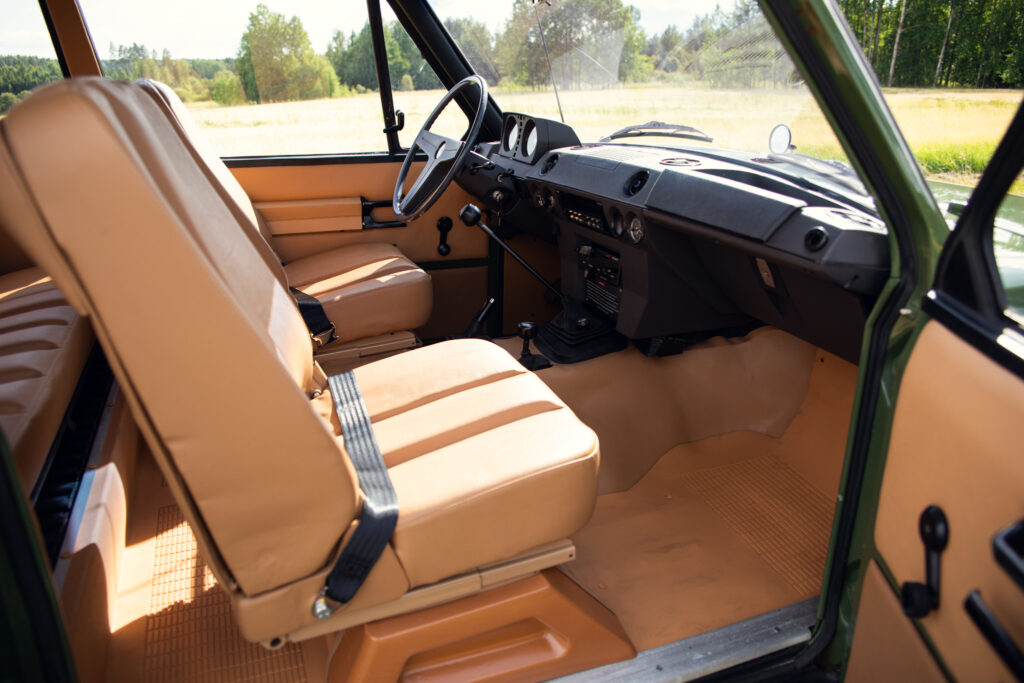 Vintage off-road vehicle interior with tan seats