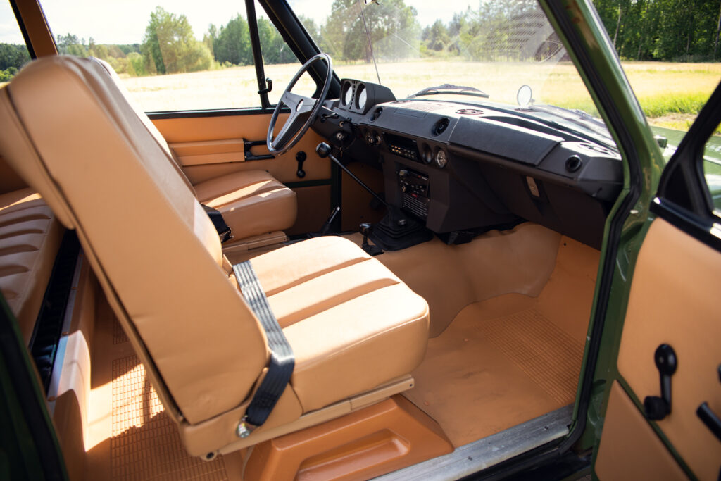 Vintage off-road vehicle interior with tan seats