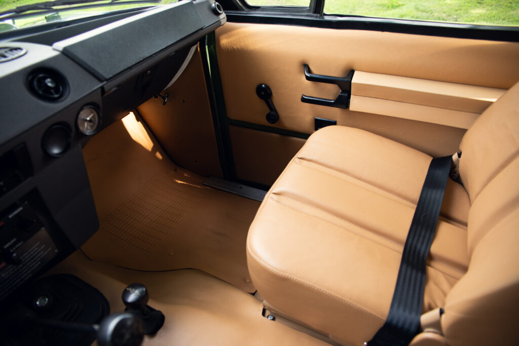 Tan leather interior of vintage off-road vehicle