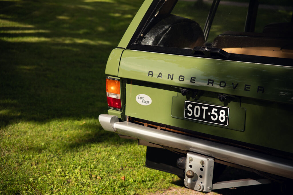 Rear of green classic Range Rover outdoors