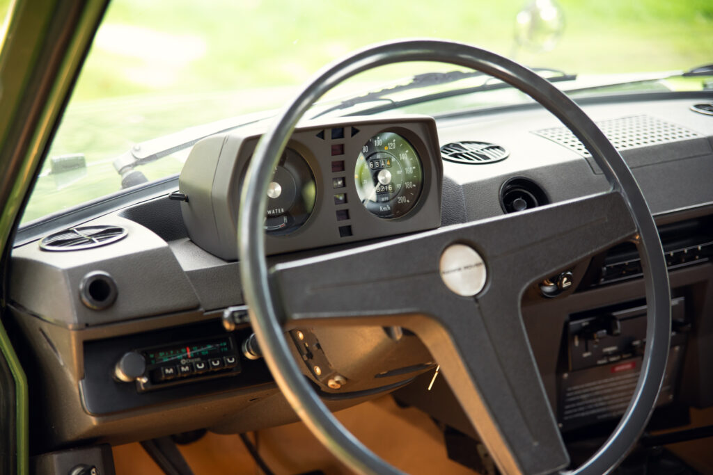 Vintage car dashboard with steering wheel and gauges