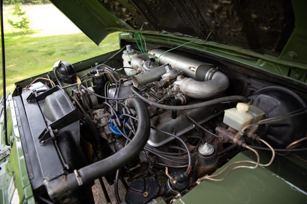 Vintage car engine under open hood